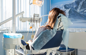 woman in dental chair during sedation, 